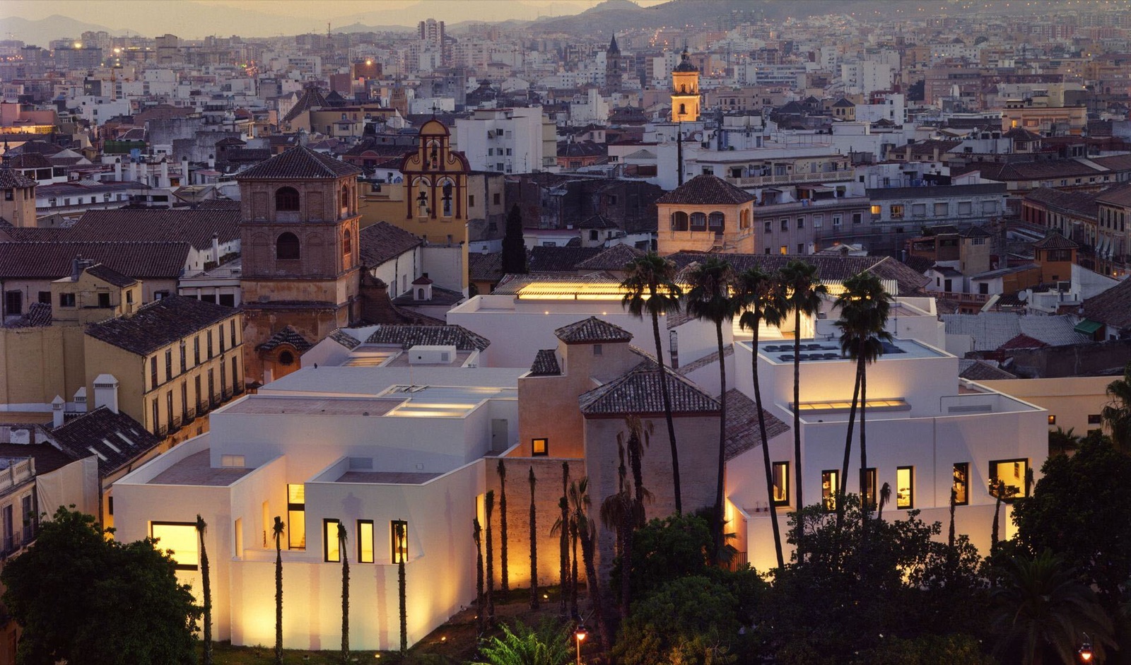 Museo Picasso Málaga at dusk, above the rooftops of the old town